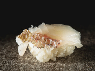 White fish sushi on a plate