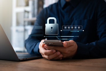 Cyber ​​network security and data protection on the internet, businessman using security encryption of laptop and smartphone with padlock icon, protecting sensitive business and financial information.