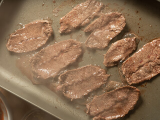 Grilling steak on a griddle
