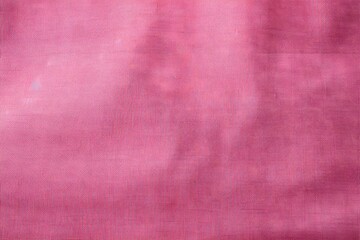 Fototapeta premium A smooth, textured fabric in a soft pink hue, suitable for fashion or decor.