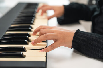 Fototapeta premium Professional Musician with condenser microphone and tablet for Mixing Mastering music. Music composer woman composing a song with guitar and piano keyboard at digital Recording home studio