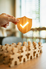 Shield icon and people model. Security protection and group  insurance. The concept of family home,...