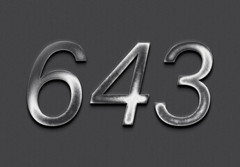 Chrome metal 3D number design of 643 on grey background.