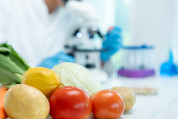 Scientist check chemical food residues in laboratory. Control experts inspect quality of fruits,...
