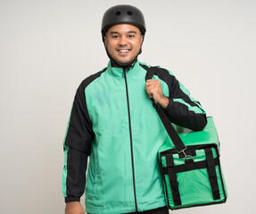 Young asian rider wearing green jacket uniform and bike helmet various action with delivery box. Male delivery service worker. Courier and shipping food service to customer online application