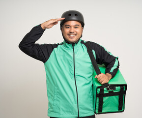 Young asian rider wearing green jacket uniform and bike helmet various action with delivery box. Male delivery service worker. Courier and shipping food service to customer online application