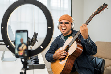Professional Musician with condenser microphone and tablet for Mixing Mastering music. Music...