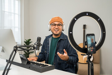 Professional Musician with condenser microphone and tablet for Mixing Mastering music. Music...
