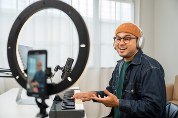 Professional Musician with condenser microphone and tablet for Mixing Mastering music. Music...