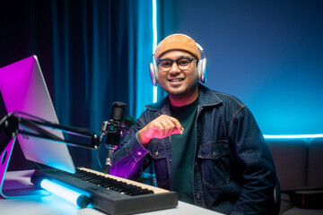 Professional Musician with condenser microphone and tablet for Mixing Mastering music. Music...