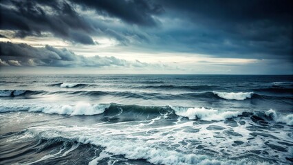 Fototapeta premium A vast, empty ocean with waves crashing against the shore in a monochromatic grey tone, beach scenes, vast ocean, seascapes, grey ocean, salty water