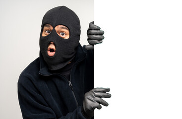 Thief in uniform black jacket various pose on isolated background. The Robber terrorism criminal...
