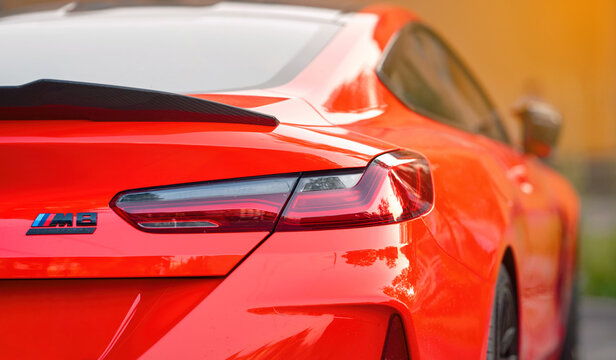 Minsk, Belarus. Jul 15, 2024. BMW M8 Competition red coupe, tail lights closeup. M8 Competition emblem and taillight closeup. BMW laser tail lights technology.