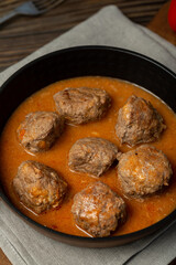 Meat balls in meat sauce in a frying pan