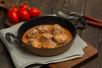 Meat balls in meat sauce in a frying pan