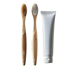 A toothbrush paired with a small tube of toothpaste, isolated on white background