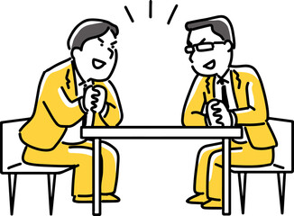 机を挟んで話をする男性社員