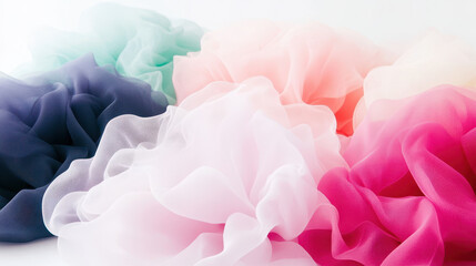 Fototapeta premium Soft pastel tulle fabric in various colors creating a dreamy and elegant texture