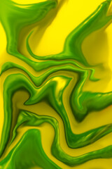 Abstract liquid  texture in vibrant green and yellow colors.