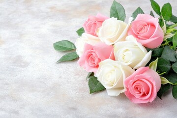 Naklejka premium A bouquet of pink and white roses arranged with green leaves on a textured background.