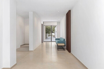 Fototapeta premium Modern hallway with minimalist design and natural light in a contemporary building