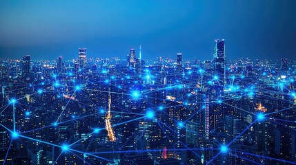Aerial view of a smart city with connections, illuminated buildings against a night sky.