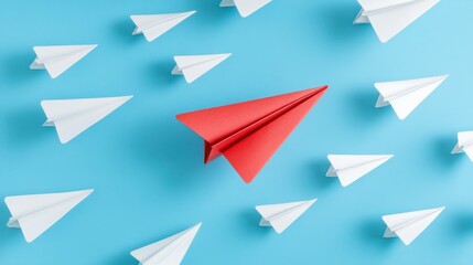 Red paper plane leading among a white planes on blue background. Business competition and Leadership concept