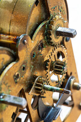 Intricate watch mechanism shows wear and oxidation marks