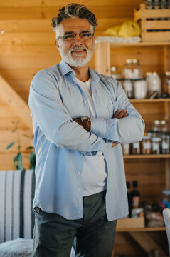 Handsome middle-aged man looking at camera.