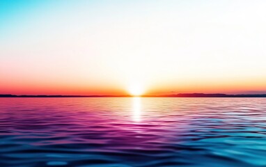 Obraz premium A tranquil sunset over water, blending vibrant hues of orange, pink, and blue, reflecting on the serene waves.