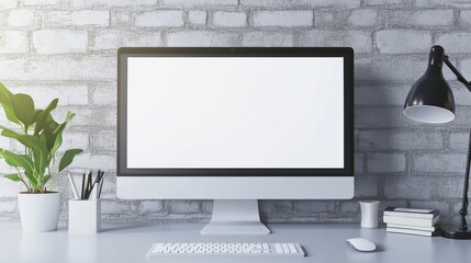 Fototapeta premium A modern workspace featuring a blank computer screen, minimalist decor, a desk lamp, a potted plant, and organized stationery against a textured brick wall.