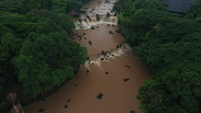 A stream in the flood season, turbid and fast-flowing in Dong Nai province, Vietnam