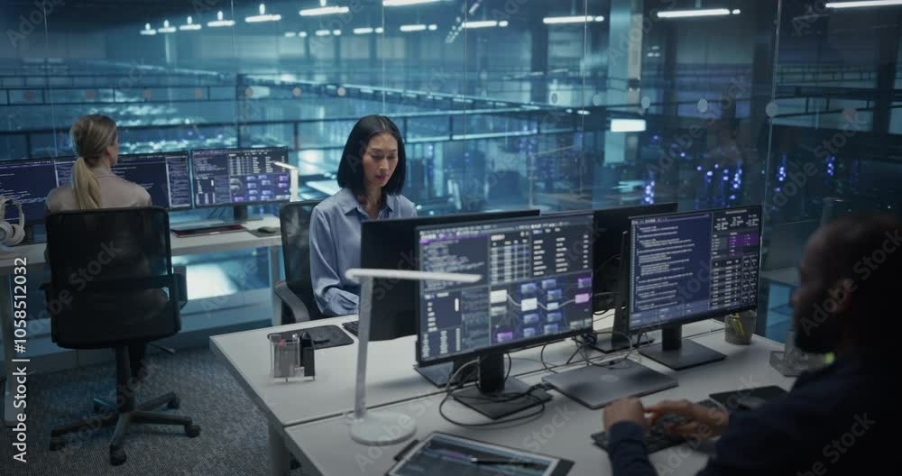 Aufkleber In a Data Center Office With Glass Walls, Diverse Female and Male Team Members Focus on Their Desktop Computers, Conducting Routine System Checks and Working on Network Improvements