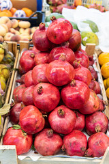 fresh pomegranate organic background juicy red healthy ripe food fruit market vegetarian closeup
