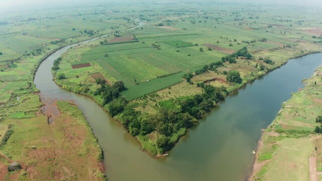Beautiful confluence of Krishna and Warana rivers, where flowing waters meet amidst serene landscapes and vibrant greenery