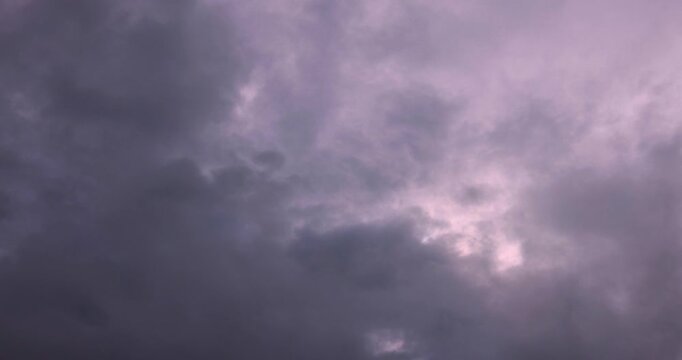 This is a time-lapse video of moving clouds and a dark sky before rain. It shows a beautiful landscape with a cloudy sky. This image was taken in Myanmar with a 4K high-resolution camera.