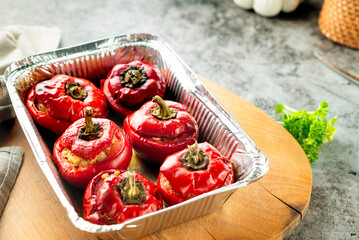 red pepper stuffed with meat and pearl barley in form.