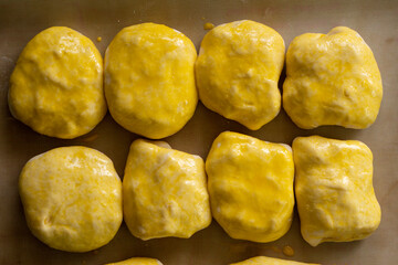 Raw buns on a baking sheet. Baking bread. Food concept