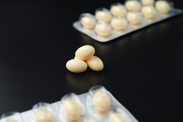Vitamin in white soft gels capsules, Fish oil, omega 3, omega 9, vitamin D, vitamin E