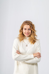 Half-length portrait of smiling young attractive blonde girl on white background