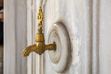 close-up of the fountains where Muslims perform ablution to worship.