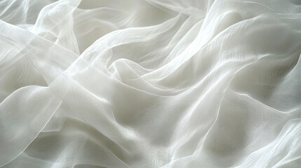Obraz premium Soft, flowing white fabric creates elegant, silky texture, perfect for backgrounds or fashion designs. delicate layers evoke sense of lightness and grace