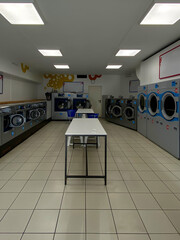 Modern self-service laundromat with washing machines and dryers