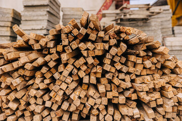 Wood stick pile stacked used in construction site for concrete precast support.