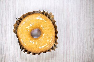 Delicious sweet glazed donut ready to eat