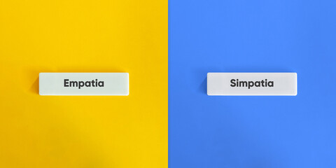 Empathy vs. Sympathy Banner. Text on Block Letter Tile on Yellow and Blue Background. Minimal Aesthetic.