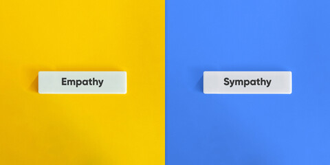 Empathy vs. Sympathy Banner. Text on Block Letter Tile on Yellow and Blue Background. Minimal...