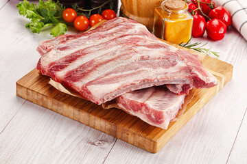 Raw pork ribs over board