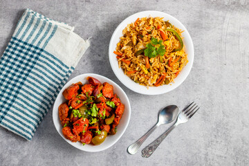 Chilli chicken is a spicy Indo-Chinese dish featuring crispy fried chicken tossed in a tangy, savory sauce with peppers and onions.