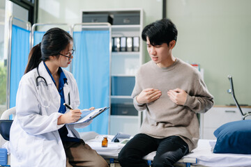 Doctor examining patient with symptoms in a clinic. Medical consultation and healthcare interaction.